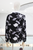 Camisa negra con flores bordadas