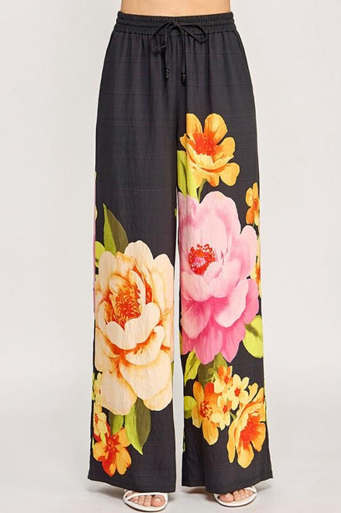 Pantalón negro con flores maxi