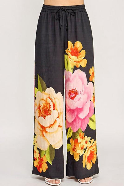 Pantalón negro con flores maxi