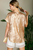 Blusa metalizada dorada