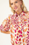 Camisa con print naranja y morado