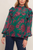 Blusa verde con flores magenta