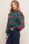 Blusa verde con flores magenta