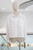 Blusa blanca con encaje floral