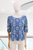 Blusa bordada azul y beige
