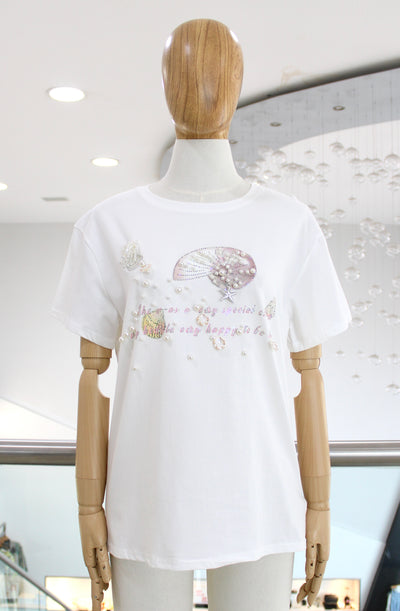 T-shirt blanca conchitas