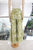 Pantalón verde con palmeras