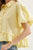 Blusa camisera amarilla