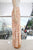 Pantalón beige con palmeras