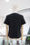 T-shirt negra ramo