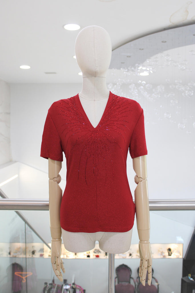 Blusa brillosa roja