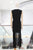 Conjunto negro chaleco y falda