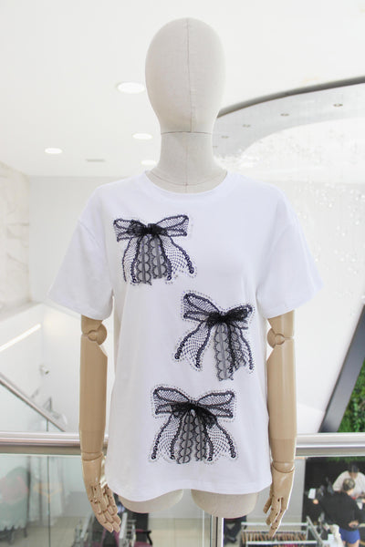 T-shirt blanca moños