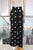 Pantalón negro con círculos