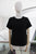 T-shirt negra