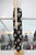 Pantalón amplio negro con beige
