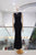 Vestido negro con aplicación dorada