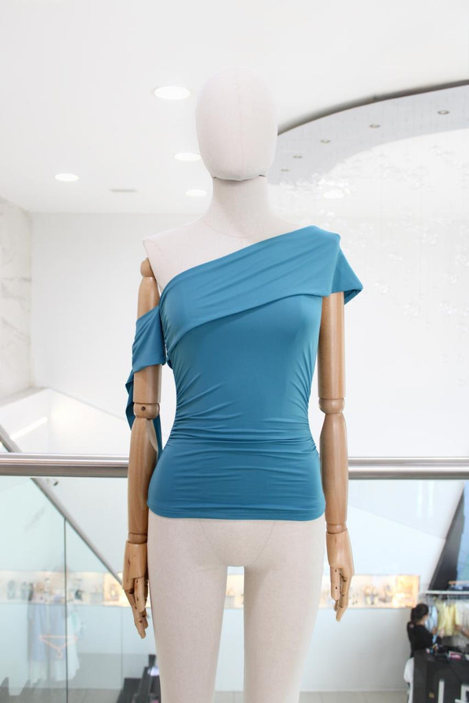 Blusa a un hombro azul