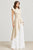 Conjunto beige y blanco