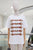 T-shirt blanca hebillas