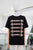 T-shirt negra hebillas