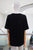 T-shirt negra perrito con lentes